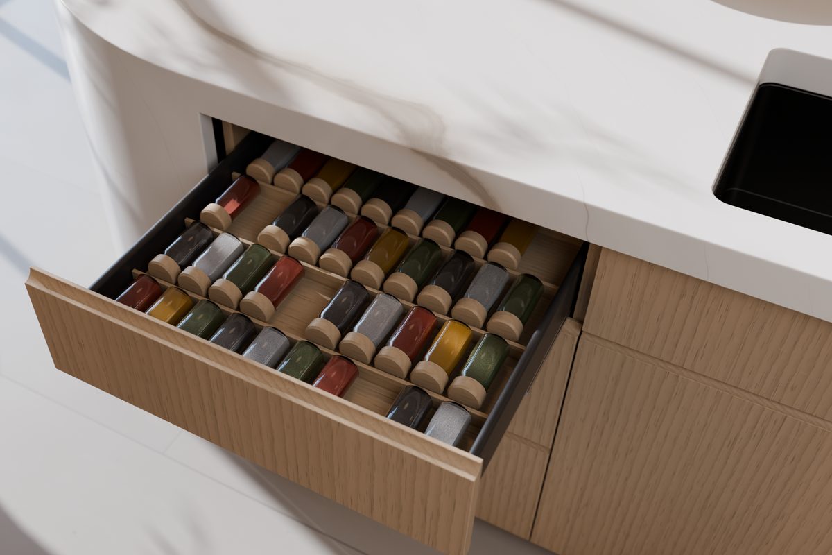 Render: the open spice drawer, with an oak insert and 36 glass jars lying down.